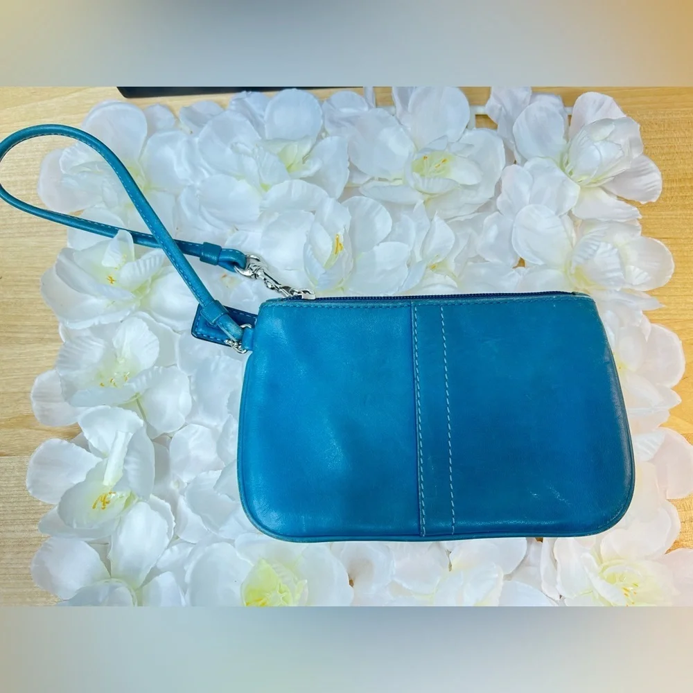 Coach Legacy Leather Small Wristlet. design is featured during Coach’s 65th